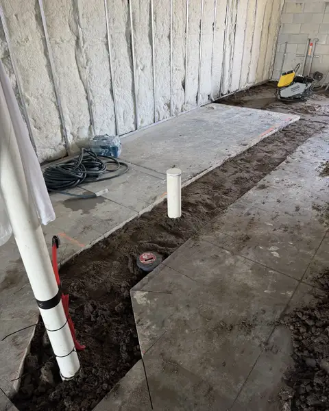 Trench dug for plumbing rough-in