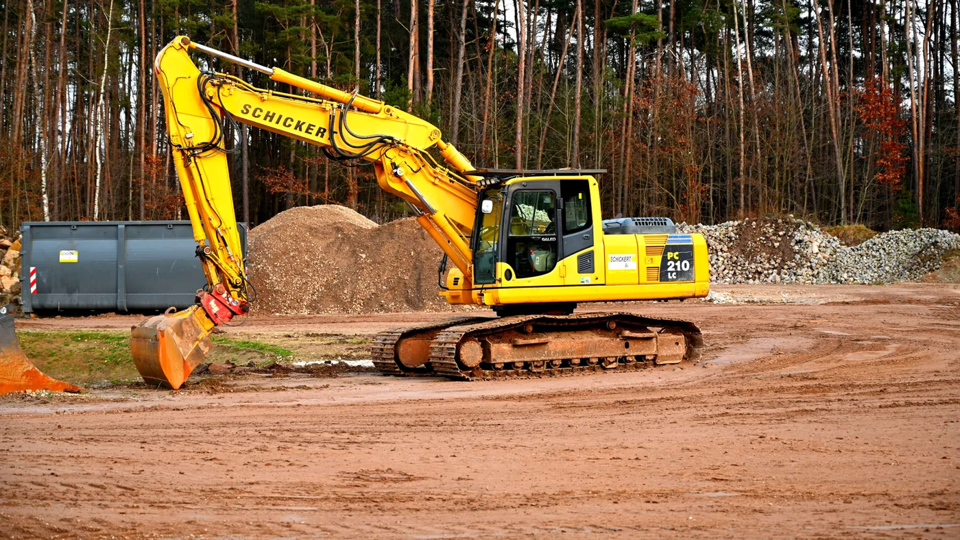 Excavator clearing a wooded lot in Central Florida